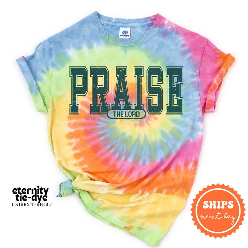 a tie - dyed shirt with the word praise on it