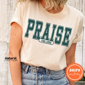 a woman wearing a t - shirt that says praise the lord