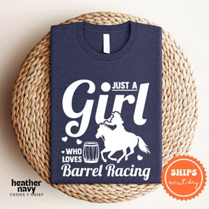 a t - shirt that says just a girl who loves barrel racing