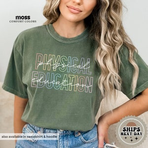 a woman wearing a green shirt that says physical education
