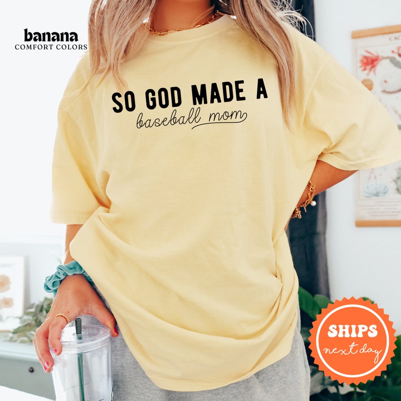 a woman in a yellow shirt holding a blender