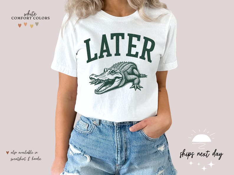 a woman wearing a white shirt with a green alligator on it