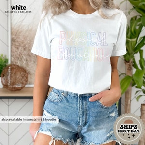 a woman wearing a white shirt and denim shorts