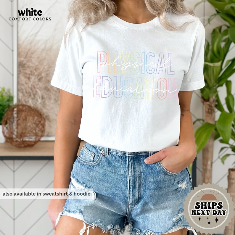a woman wearing a white shirt and denim shorts
