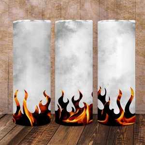 May include: Three white tumblers with a gray and white marble design and a row of orange flames at the bottom. The tumblers are on a wood surface. The background is a gray and white marble design.