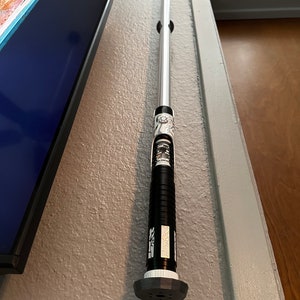 Lightsaber Wall Holder. Purchase at TWITCHUNLIMITEDSTORE.COM