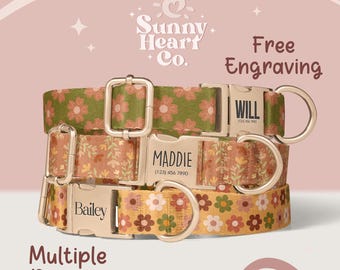 May include: Three dog collars with floral patterns in green, orange, and yellow. Each collar has a silver buckle with a name engraved on it: "Will", "Maddie", and "Bailey". The collars are from Sunny Heart Co. and offer free engraving.