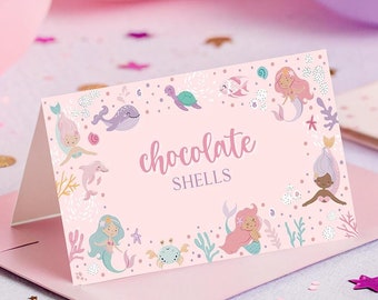 May include: Pink and blue mermaid themed printable favor tag with the text "chocolate shells".