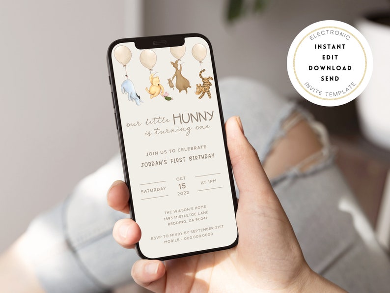 May include: A digital invitation on a smartphone screen for a first birthday party. The invitation features a Winnie the Pooh theme with illustrations of Winnie the Pooh, Piglet, Tigger, and Eeyore. The text reads "our little Hunny is turning one" and includes details about the party, such as the date, time, and location.