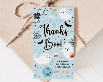 May include: A light blue Halloween-themed gift tag with the words "Thanks Boo!" and illustrations of ghosts, bats, spiders, and pumpkins. The tag includes the text "For making my birthday spooktacular" and "Love, Jessie".
