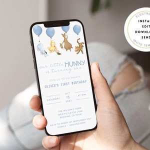 May include: A blue and white digital invitation for a first birthday party. The invitation features a Winnie the Pooh theme with illustrations of Winnie the Pooh, Piglet, Tigger, and Eeyore. The text on the invitation reads "our little HUNNY is turning one" and "Oliver's First Birthday". The date and time of the party are listed as "Saturday, October 15, 2022 at 1 PM". The location of the party is listed as "The Wilson's Home, 1893 Mistletoe Lane, Redding, CA 90241". The RSVP information is listed as "RSVP to Mindy by September 21st, Mobile 000-000-0000".