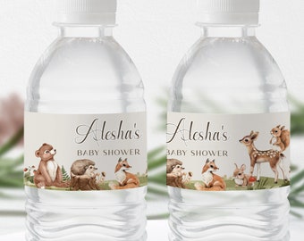 May include: Two clear plastic water bottles with labels that say "Alesha's Baby Shower". The labels feature woodland animals, including a bear, hedgehog, fox, deer, and rabbit.