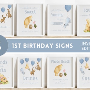 May include: Eight framed signs for a 1st birthday party, featuring watercolor illustrations of Winnie the Pooh characters. Signs include "Photo Guestbook", "Babies are Sweet", "A Little Yummy for your Tummy", "Favors", "Cards and Gifts", "Drinks", "Photo Booth", and "Custom".