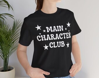 Main Character Club Graphic Tee: Bold Empowerment Shirt