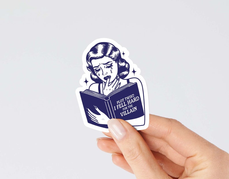 May include: A blue and white sticker featuring a cartoon woman reading a book. The book reads "Plot Twist: I Fell Hard For The Villain".