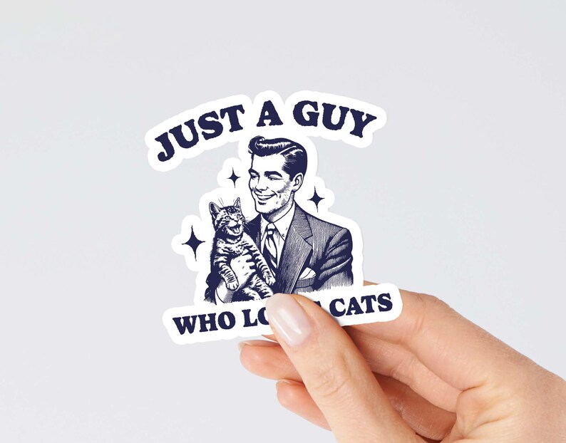 May include: A sticker featuring a vintage illustration of a man holding a cat. The text reads "Just a guy who loves cats".