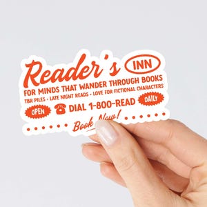 May include: A white sticker with orange text that reads "Reader's Inn" for minds that wander through books. TBR piles, late night reads, love for fictional characters. Open, dial 1-800-READ, daily. Book now!