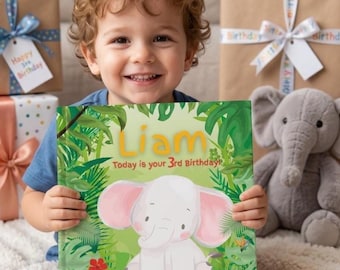 May include: A hardcover book with a jungle-themed cover featuring a white elephant illustration, green foliage, and the text Liam Today is your 3rd Birthday. The book is held by a child with curly hair, surrounded by wrapped birthday gifts.
