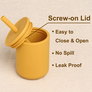 Personalized yellow silicone baby sippy cup with screw-on lid with make it no-spill and leak-proof.