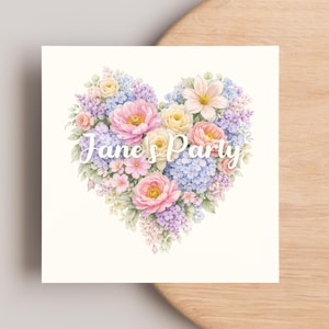 May include: A square card featuring a heart-shaped floral arrangement. The heart is composed of pink, yellow, and purple flowers, with green foliage. The words "Jane's Party" are written in white script across the center of the heart.