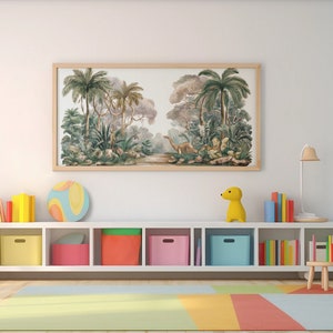 May include: A white bookshelf with six shelves filled with colorful books and toys. The top shelf has a framed print of a jungle scene with palm trees and a dinosaur. A yellow toy dinosaur sits on the shelf below the print.