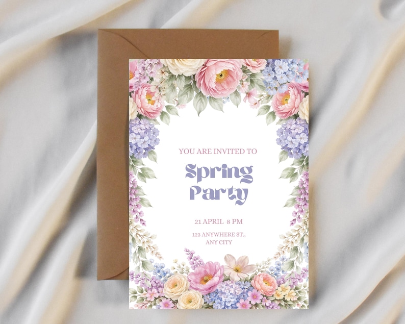 May include: A floral invitation with the text "YOU ARE INVITED TO Spring Party" in a soft purple font. The invitation is surrounded by watercolor flowers in pink, purple, and yellow. A brown envelope is behind the invitation.