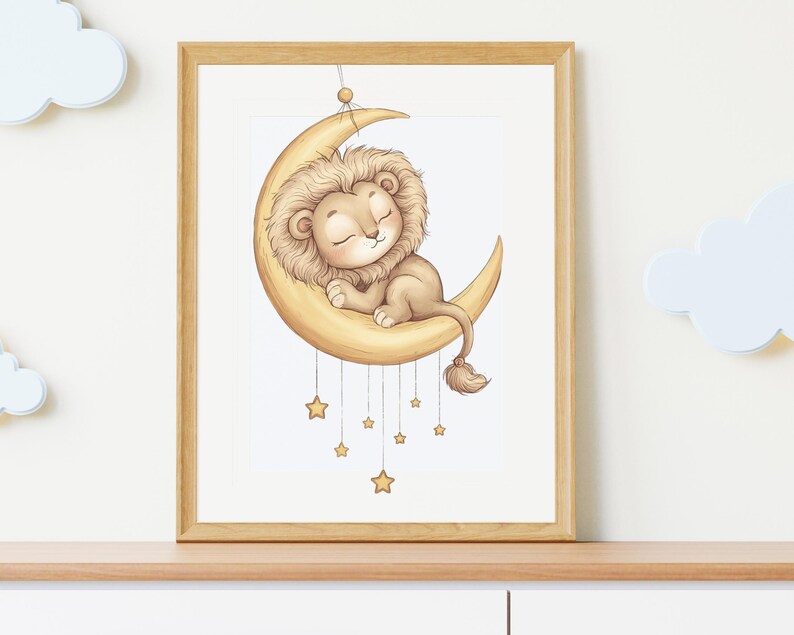 May include: A framed illustration of a sleeping lion cub on a crescent moon. The lion has a tan mane and is resting on a yellow moon. Several gold stars hang below the moon. The artwork is in a wooden frame.
