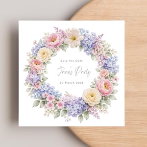 May include: Square invitation card featuring a watercolor floral wreath in pastel colors. The wreath includes pink roses, yellow flowers, and blue and purple hydrangeas. Text inside the wreath reads "Save the Date" and "Jane's Party, 30 March 2026".