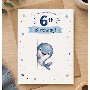 May include: A white birthday invitation card featuring a cartoon blue whale peeking from behind a vertical line. The text reads "You're invited to my 6th Birthday!" on a light blue banner. The card is decorated with small blue and gold stars.