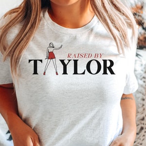 Taylor Swiftie Shirt, Taylor Swiftie Merch Tshirt, Raised by Taylor Shirt, Swiftie T shirt, Eras Tour Shirt, Swiftie Gifts