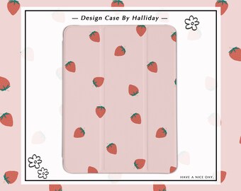 May include: A pink iPad case with a strawberry pattern. The case has a flap that folds over the screen to protect it. The text "Design Case By Halliday" is printed on the case. The text "HAVE A NICE DAY." is printed below the case.