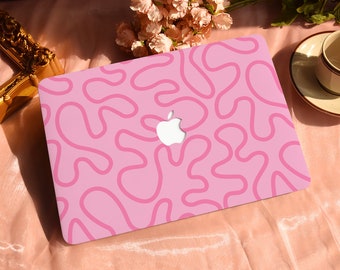 May include: A pink laptop with a pink abstract pattern and an apple logo.
