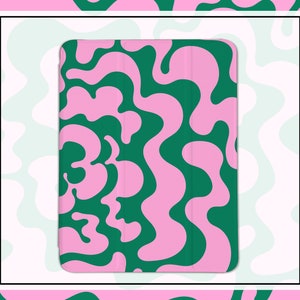 Puede incluir: Una funda para tablet con un patrón abstracto ondulado en rosa y verde.