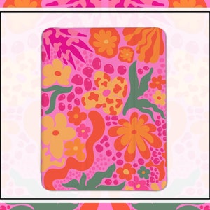 May include: A pink phone case with a retro floral pattern featuring orange, pink, and green flowers and leaves.