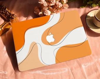 May include: A laptop computer with a white and orange abstract design. The Apple logo is visible on the laptop.