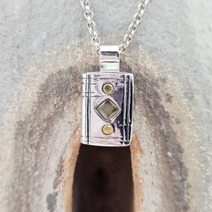 Book pendant made of sterling silver, unique piece, handmade, novel, fairy tale, story, fantasy, library, magic, spell, love