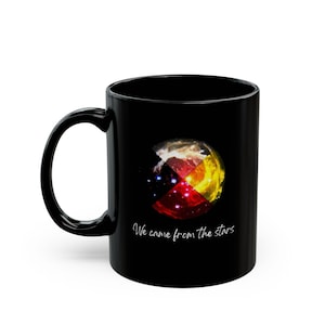 May include: Black ceramic mug with a colorful galaxy design and the text "We came from the stars".