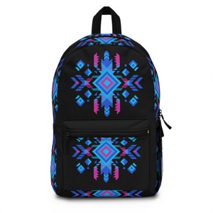 May include: Black backpack with a geometric pattern in shades of blue, pink, and white. The pattern is reminiscent of Native American art.