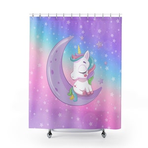 May include: A purple shower curtain with a white unicorn sleeping on a crescent moon. The background is a gradient of pink, blue, and purple with white stars.