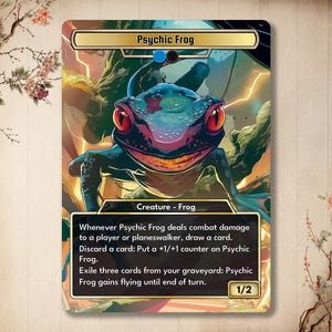 May include: A fantasy trading card featuring a green, blue, and purple frog with a toothy grin. The card is titled "Psychic Frog" and has the text "Whenever Psychic Frog deals combat damage to a player or planeswalker, draw a card. Discard a card: Put a +1/+1 counter on Psychic Frog. Exile three cards from your graveyard: Psychic Frog gains flying until end of turn. 1/2".