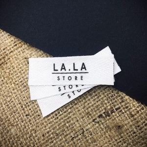 Custom Twill Fold Labels – 50–500 pcs | Cotton Logo & Care Tags | Digital Proof in 24h