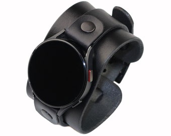May include: Black leather watch band with a round black watch face.
