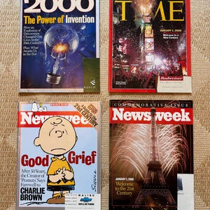 May include: Four vintage magazines from January 2000. Top left: Newsweek Extra 2000 The Power of Invention. Top right: Time Commemorative Issue January 1, 2000. Bottom left: Newsweek Good Grief Charlie Brown. Bottom right: Newsweek Commemorative Issue.