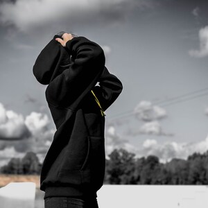 Unisex Oversized Black Hoodie with kangaroo pocket. image 8