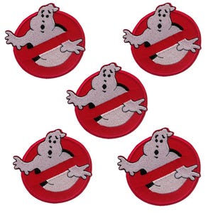 May include: Five red and white embroidered iron-on patches featuring the Ghostbusters logo with a ghost inside.