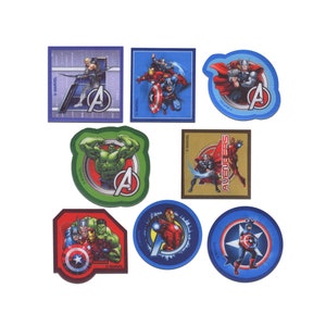 May include: Set of eight Avengers themed iron-on patches. The patches feature various Avengers characters, including Iron Man, Captain America, Thor, Hulk, and Hawkeye. The patches are all in a circular or square shape and have a red, blue, and green colour scheme.