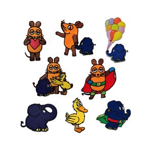 May include: A selection of embroidered patches depicting cartoon characters. The patches feature a mouse holding a heart, a mouse with a cape, a duck, and several elephants. The patches are in various colours, including orange, blue, and yellow.