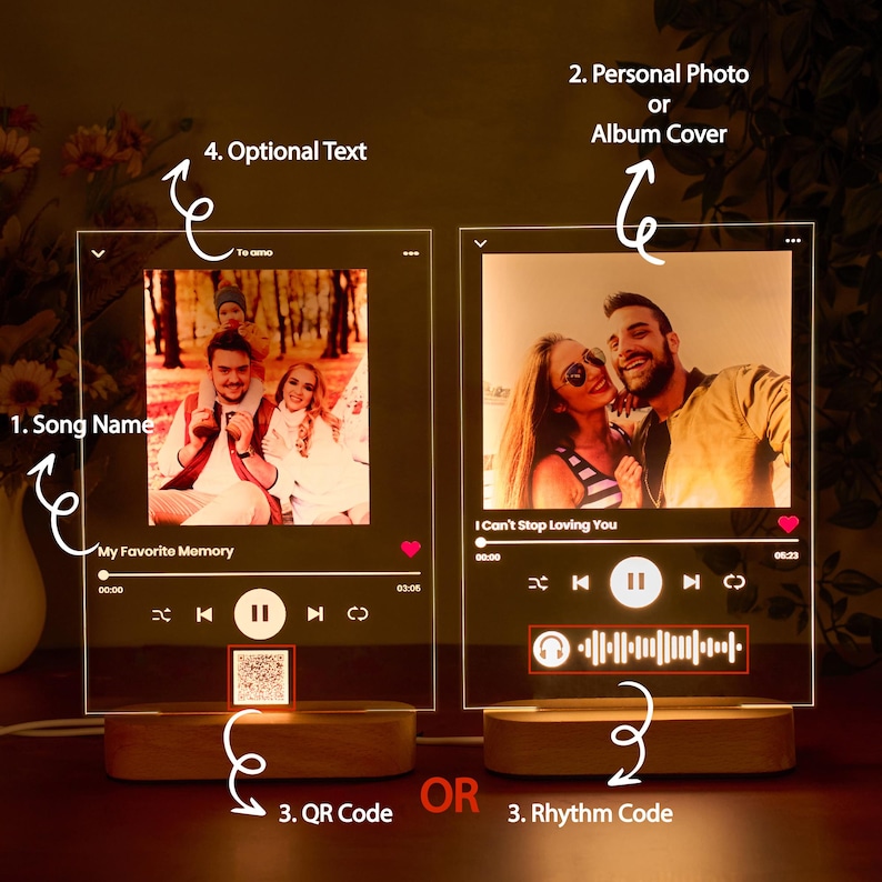 May include: Two illuminated acrylic frames with a music player interface. The left frame shows a photo of a family of three and the text "My Favorite Memory". The right frame shows a photo of a couple and the text "I Can't Stop Loving You". Both frames have a play button, a pause button, a rewind button, and a fast forward button. The left frame has a QR code and the right frame has a rhythm code.
