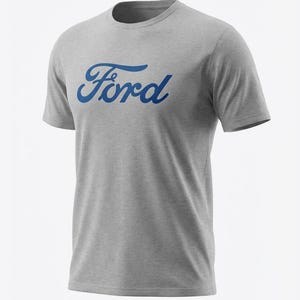 May include: A gray t-shirt with the word "Ford" in blue script across the chest. The shirt has short sleeves and a crew neck. The Ford logo is a classic design.