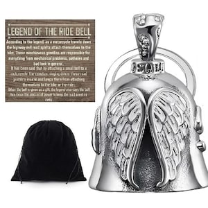 May include: A silver motorcycle ride bell with angel wings design. Includes a black drawstring bag and a wooden sign with text about the legend of the ride bell. The bell is a protective charm for motorcycle riders.